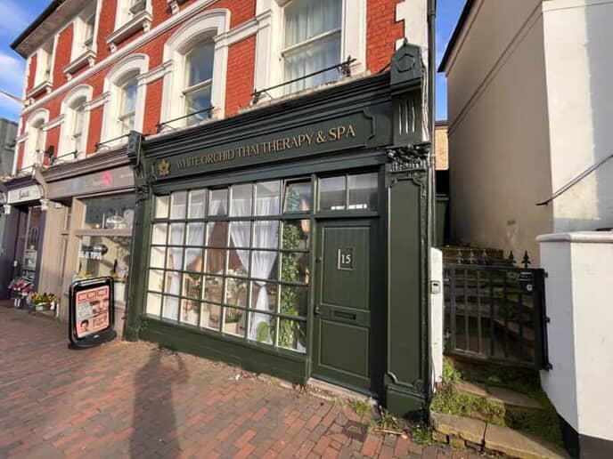 An image of the White Orchid Therapy & Spa exterior signage.